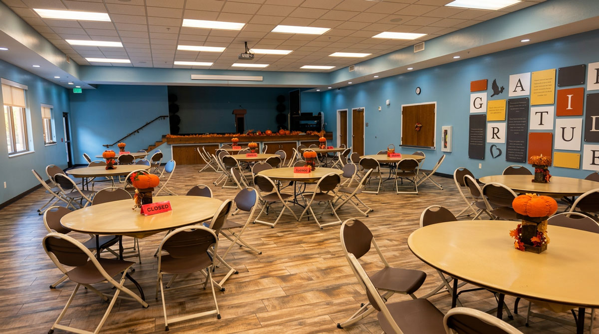 Volunteers serving hot meals in the Food & Care Coalition dining room