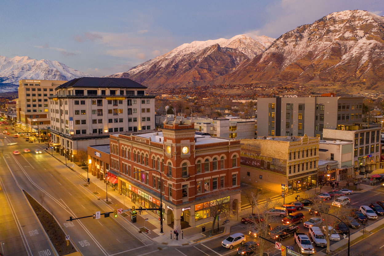 Warm golden hour aerial view of Provo and Utah Valley with the Wasatch Mountains