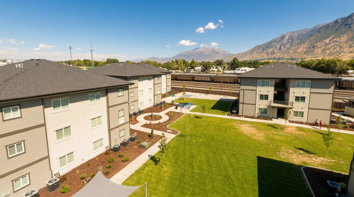 Food & Care Coalition housing buildings with the Wasatch Mountains in the background